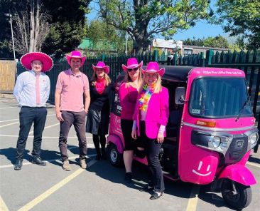 Pink tuk tuk and Rosie May Foundation team during Rosie May Day charity event