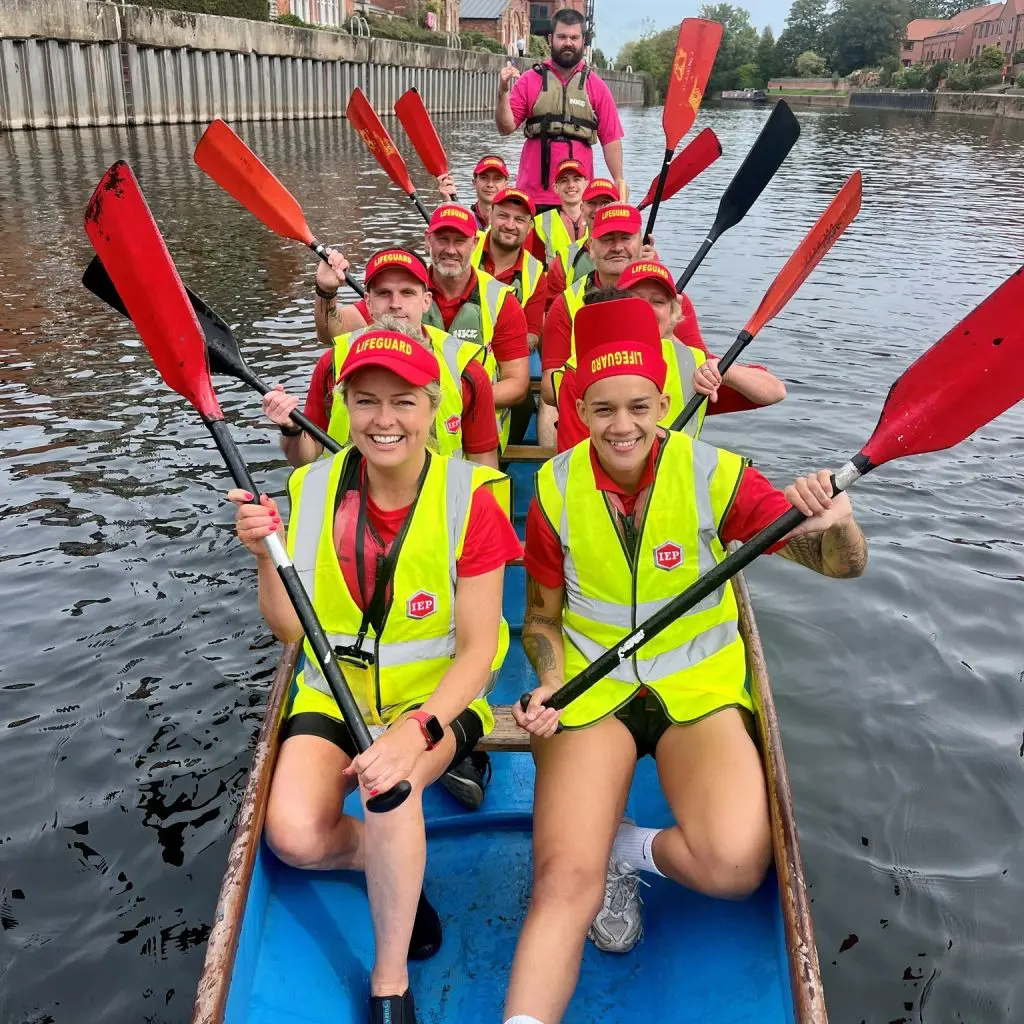 Dragon boat racing at the Newark Dragon Boat Festival with the International Export Packers team participating in the community event.