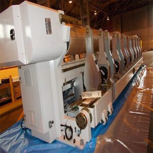 30-tonne slitter securely packed, vacuum-sealed, and shrink-wrapped on a flat-rack for international shipping.