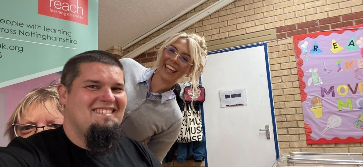 Jonny smiling with the barber before having his renowned beard shaved off at the Great Shave Off fundraiser.