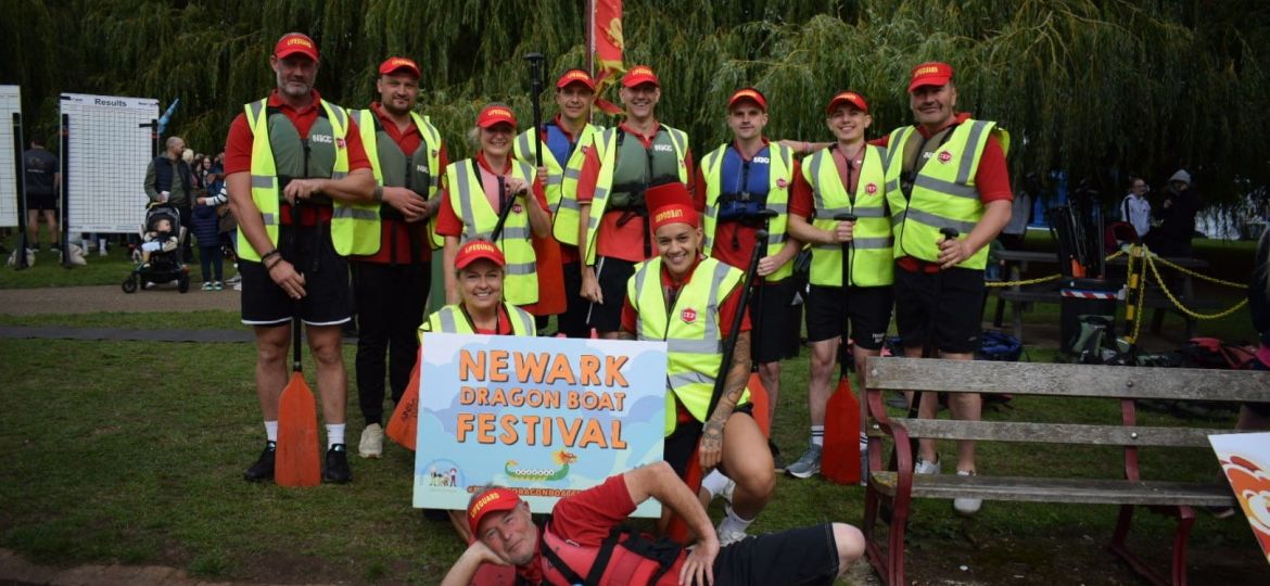 International Export Packers team taking part in the Newark Dragon Boat Festival on the River Trent, celebrating teamwork and community involvement.