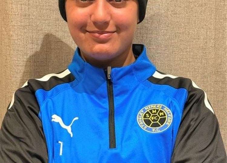 Olivia Valentine, a young goalkeeper sponsored by International Export Packers, in football kit preparing for her move to the USA to play college soccer.
